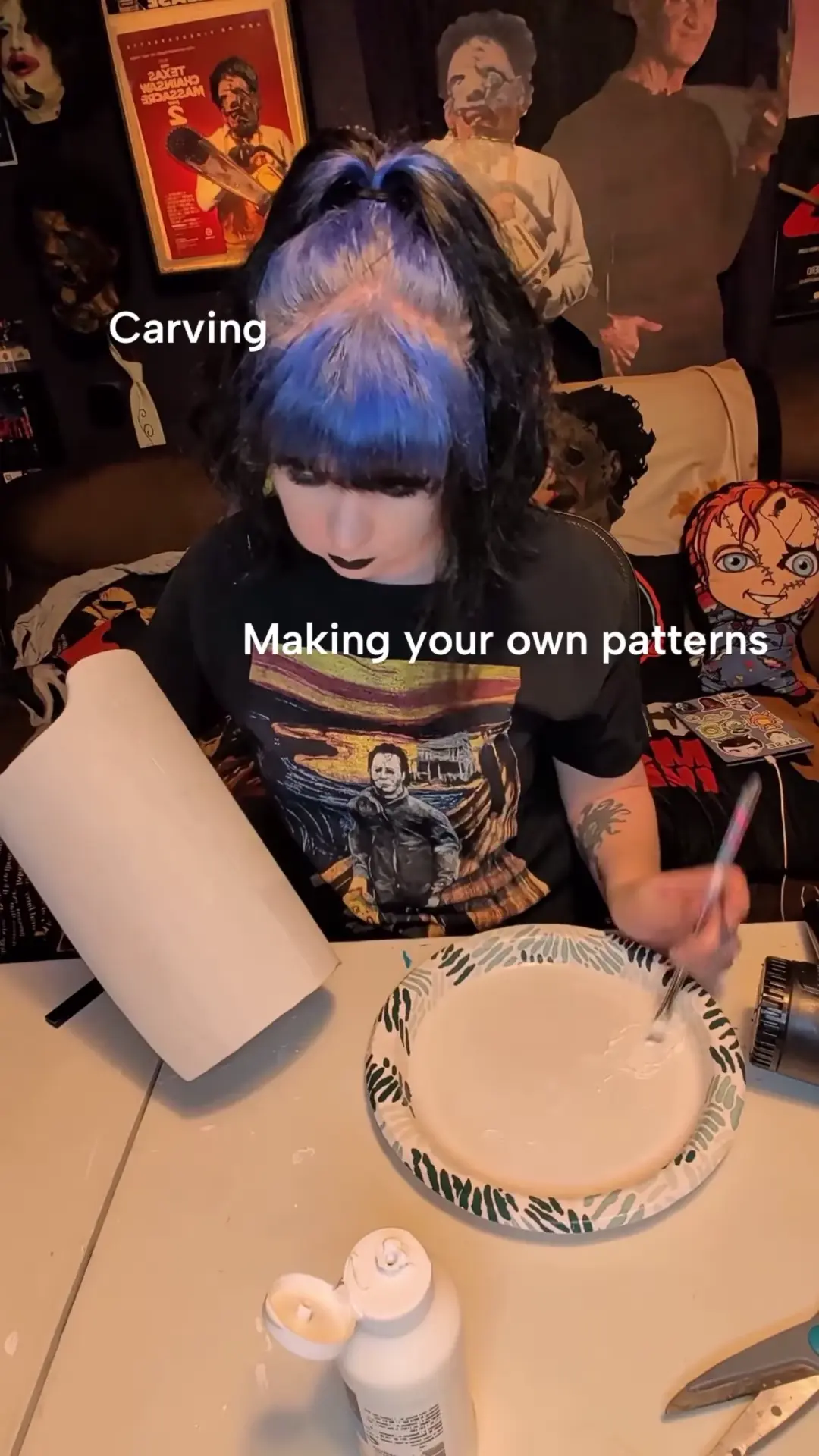 Mariah working at her craft table on a curved piece of Frieza costume armour